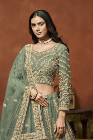 Green net designer lehenga choli._Satika India